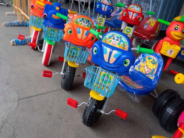 Toy tricycles at a HUG community event